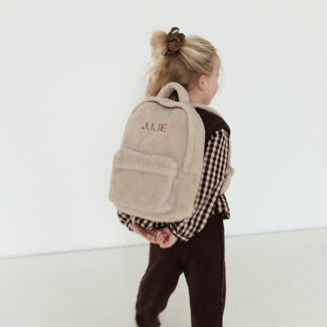 Een gepersonaliseerde rugzak van teddy