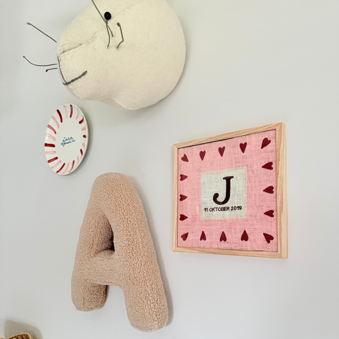 Een gepersonaliseerd geboorte poster in het roze