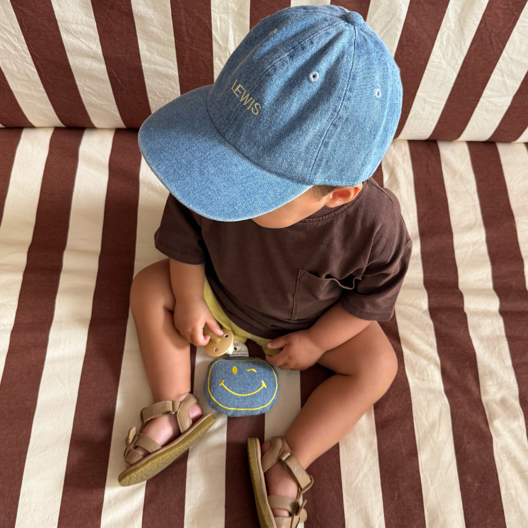 Een gepersonaliseerd speendoekje van spijkerstof