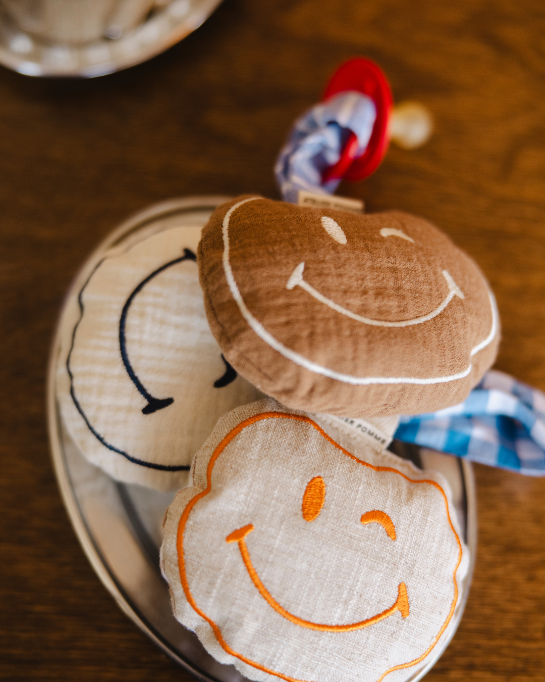 Een gepersonaliseerd speendoekje in het bruin smiley